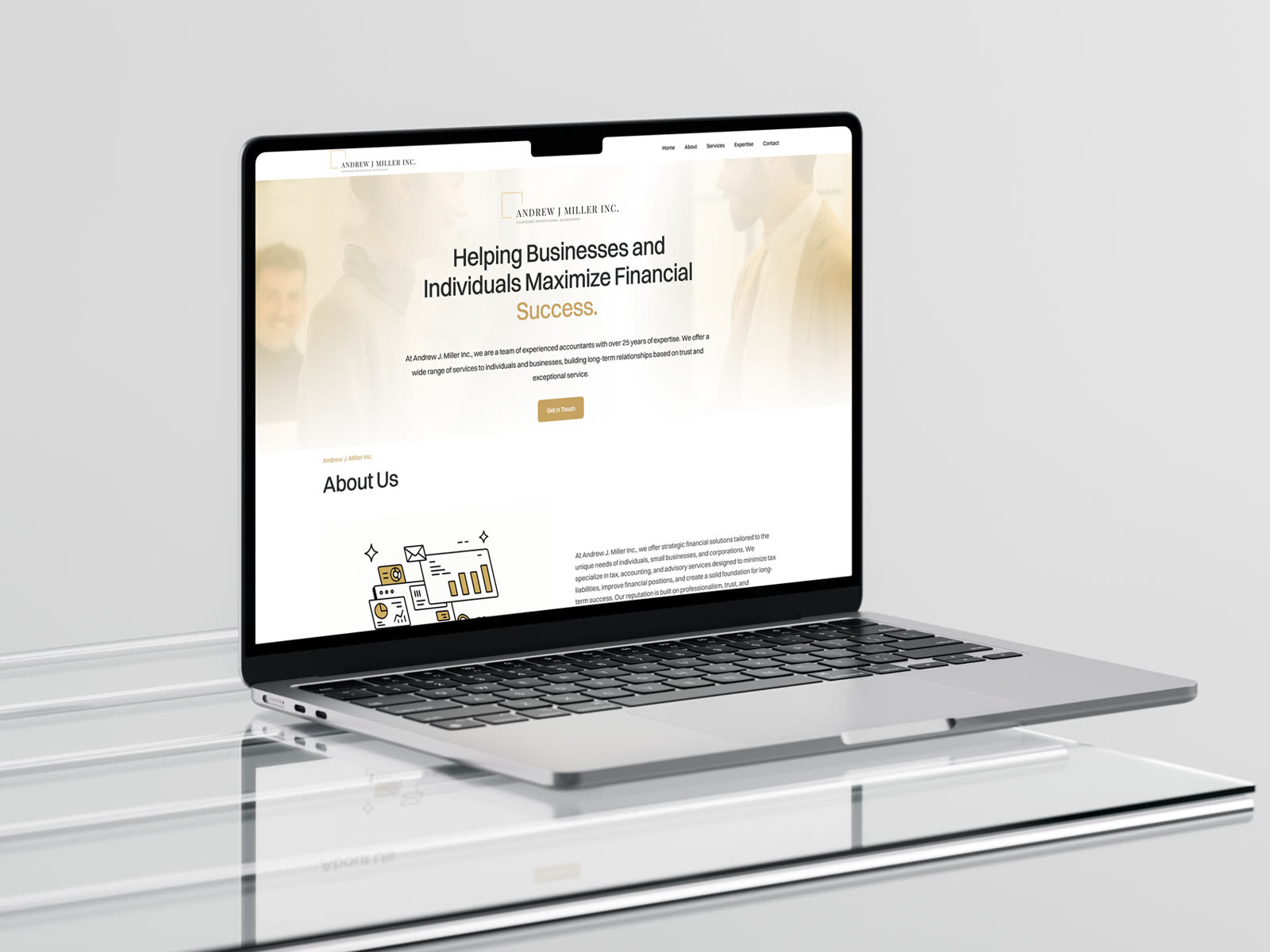 Andrew J Miller Inc. website on a laptop